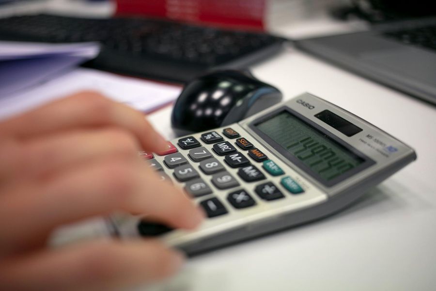 Detailed close-up of a professional working at a clean desk.